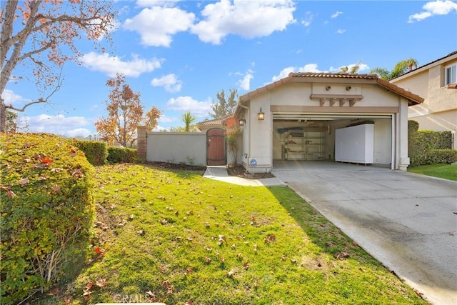 mediterranean / spanish home featuring a garage and a front lawn