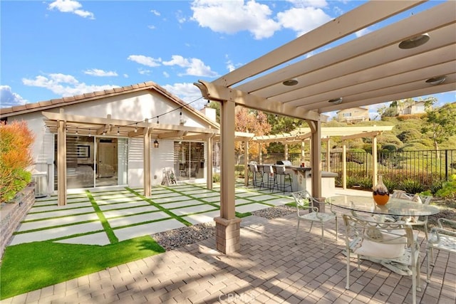 view of patio / terrace with a pergola and an outdoor bar