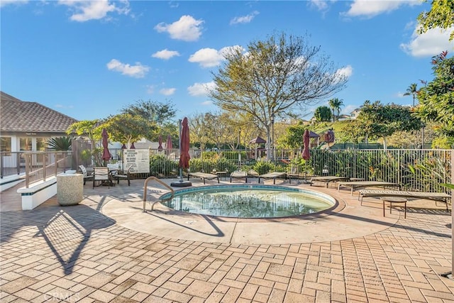 view of pool featuring a patio area