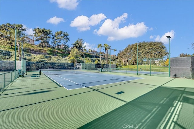 view of sport court featuring basketball hoop