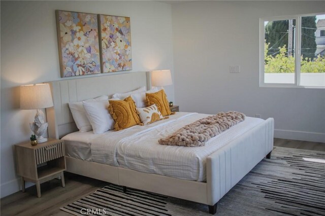 bedroom featuring dark wood-type flooring