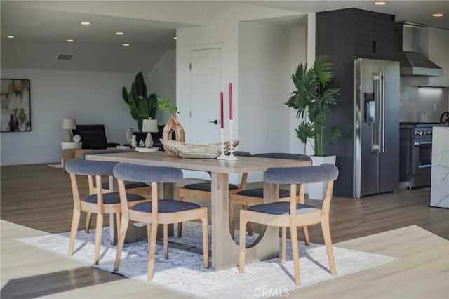 dining space featuring hardwood / wood-style flooring