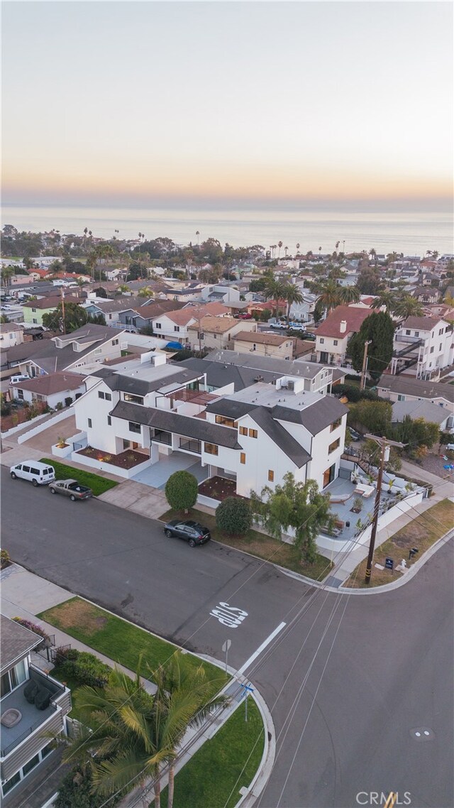 aerial view at dusk with a water view