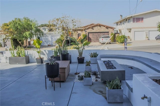 view of patio featuring an outdoor fire pit