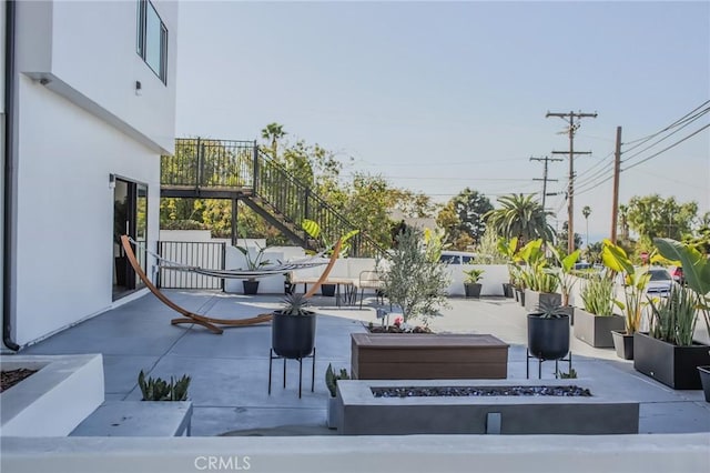 view of patio / terrace with a fire pit