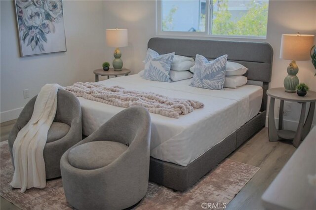 bedroom featuring hardwood / wood-style flooring