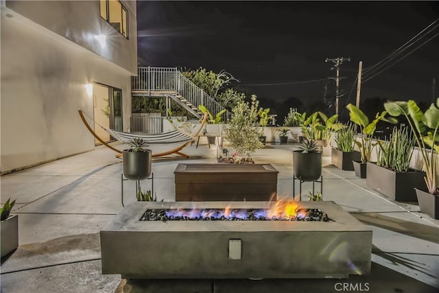 exterior space featuring an outdoor fire pit