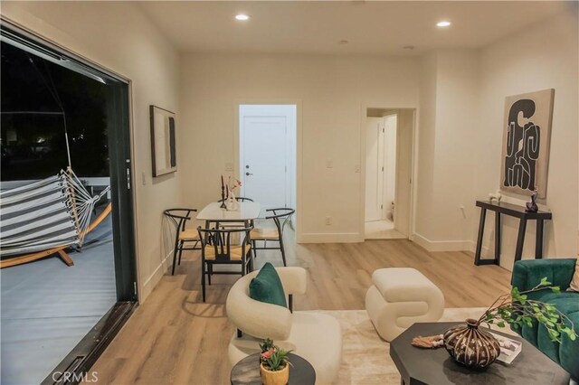 living room with light hardwood / wood-style floors