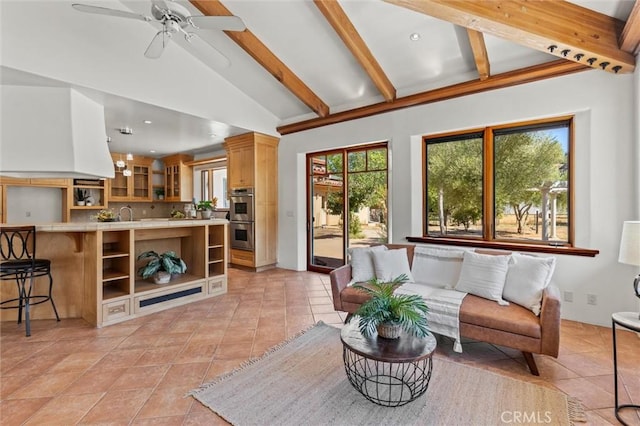 tiled living room with lofted ceiling with beams and ceiling fan