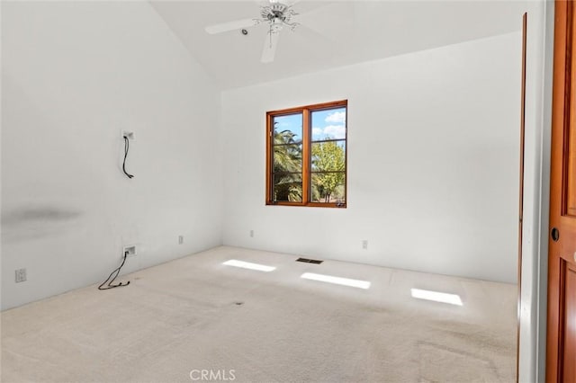 unfurnished room with ceiling fan, light carpet, and lofted ceiling