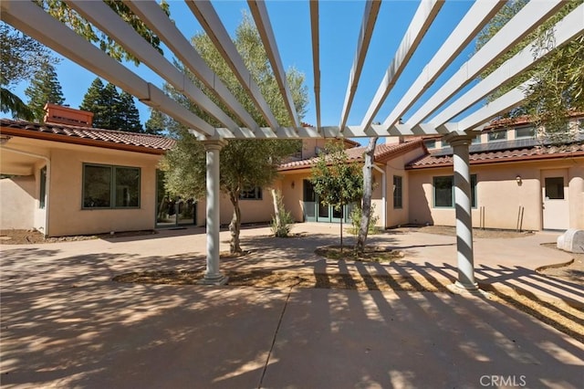 view of patio featuring a pergola