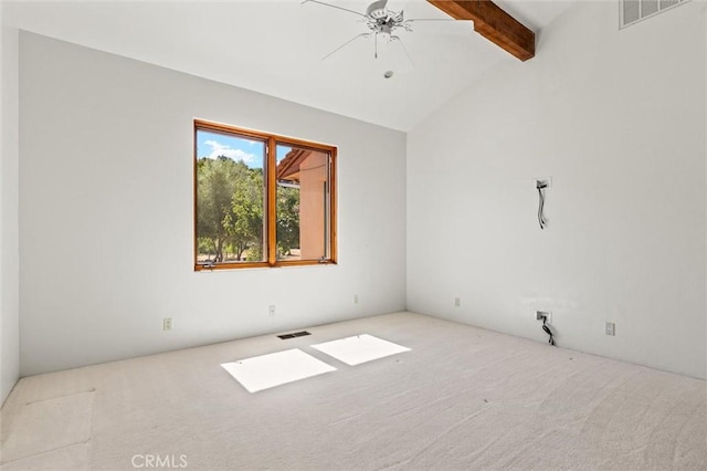 unfurnished room featuring vaulted ceiling with beams, ceiling fan, and light carpet