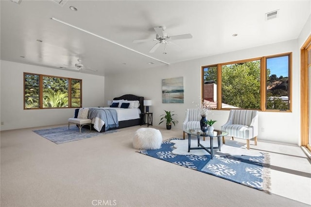 bedroom featuring ceiling fan and carpet floors