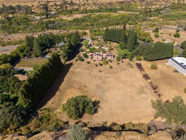 birds eye view of property featuring a rural view