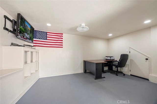 home office with concrete flooring