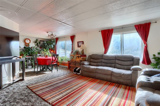 carpeted living room with a healthy amount of sunlight