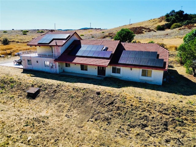 back of property with solar panels