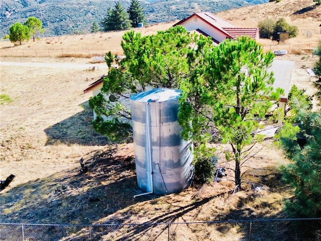 birds eye view of property with a rural view