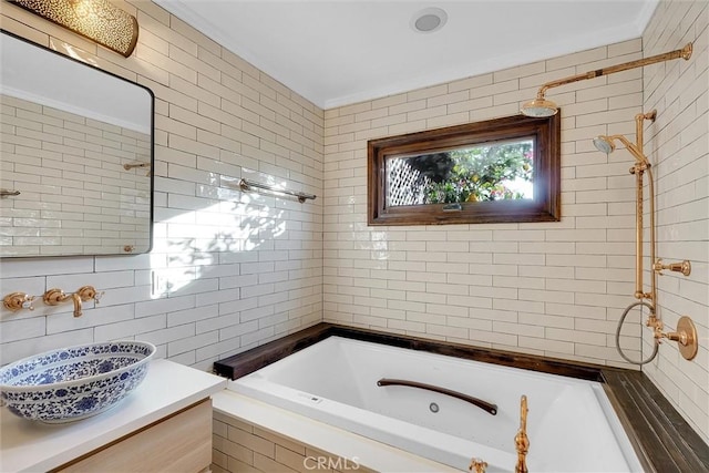 bathroom featuring tile walls, vanity, and tiled shower / bath combo