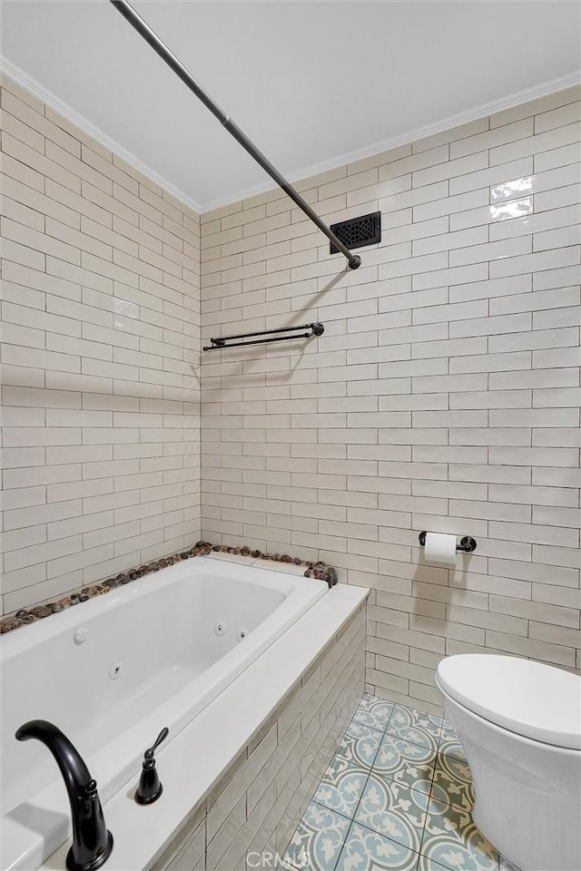 bathroom with toilet, tiled shower / bath combo, crown molding, and tile walls