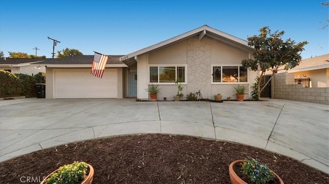 ranch-style house featuring a garage