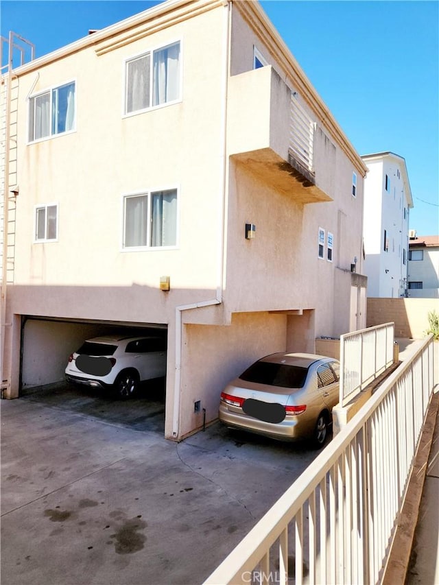 rear view of property with a garage