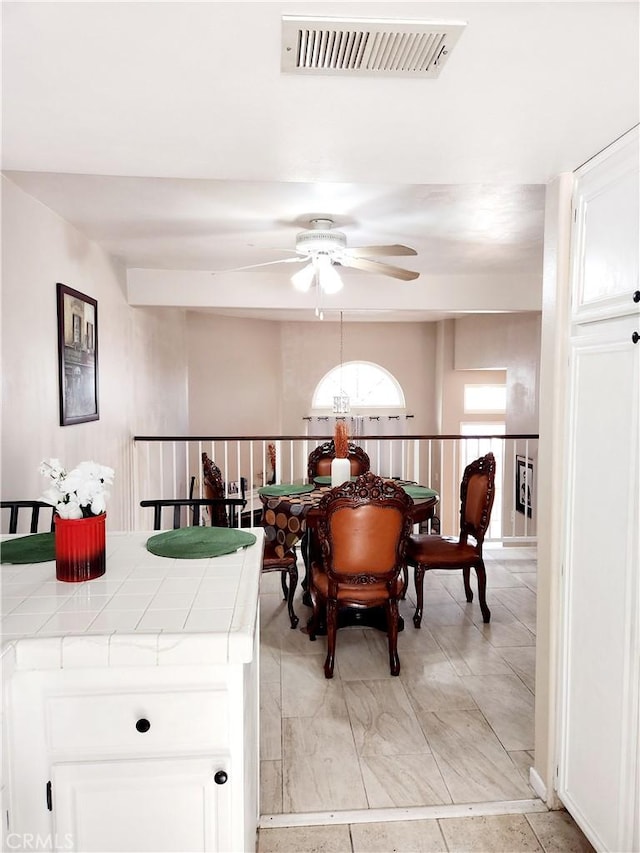 dining space featuring ceiling fan