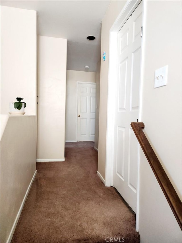 corridor with dark carpet