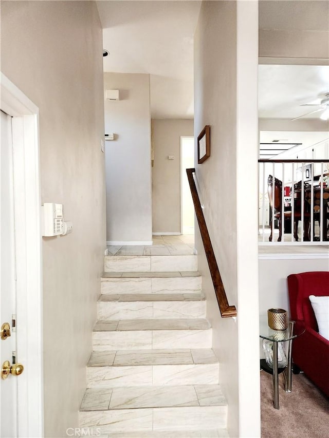 staircase with ceiling fan