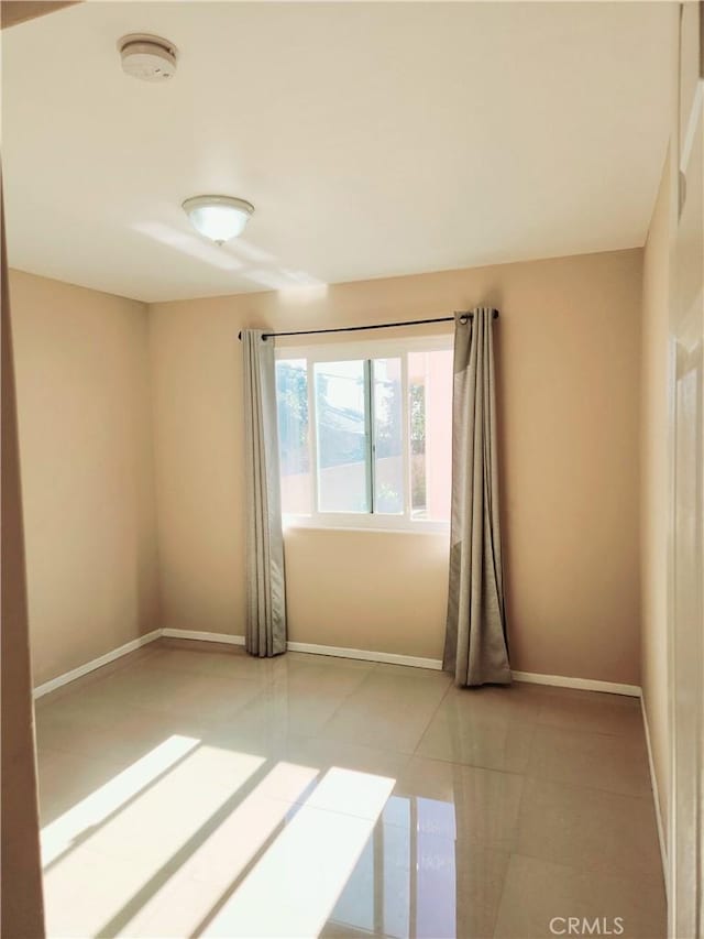 view of tiled spare room