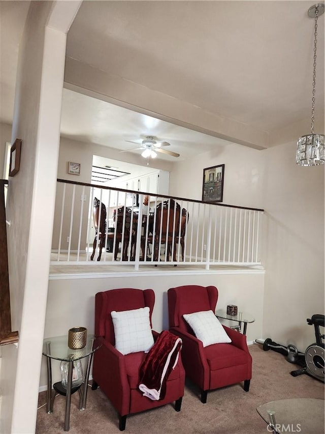 sitting room with carpet and ceiling fan