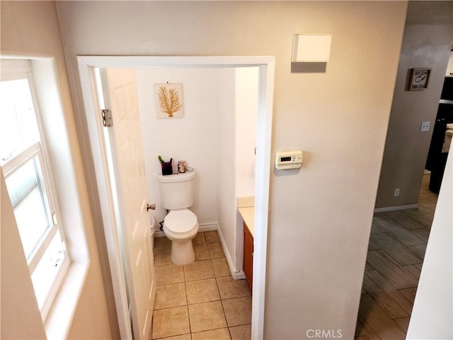 11608 Valley View Ave Unit 6, Whittier, CA 90604 - bathroom with baseboards, tile patterned flooring, and toilet
