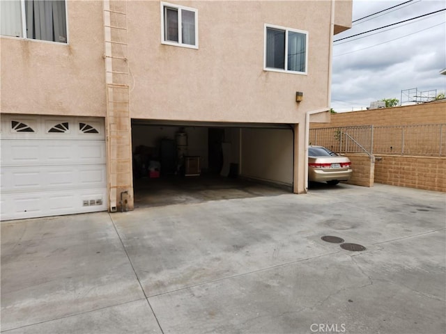 11608 Valley View Ave Unit 6, Whittier, CA 90604 - garage featuring fence and driveway