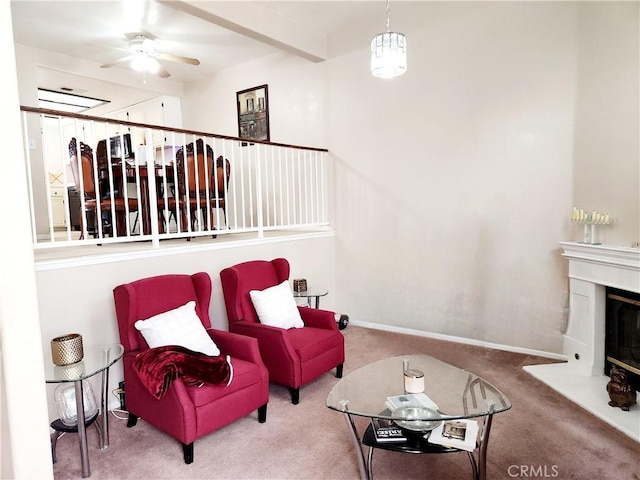 11608 Valley View Ave Unit 6, Whittier, CA 90604 - carpeted living room featuring a ceiling fan, beamed ceiling, a glass covered fireplace, and baseboards