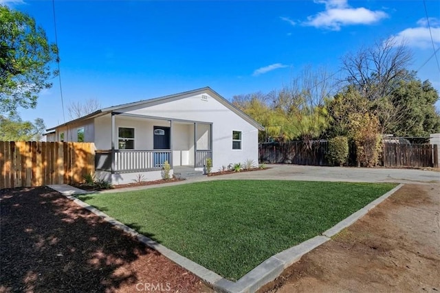 view of front of property with a front yard and a porch