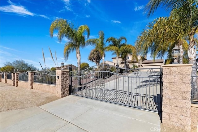 view of gate featuring fence