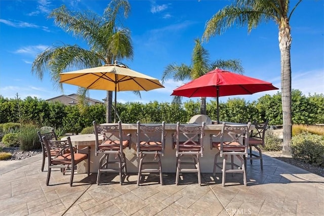 view of patio / terrace with outdoor dry bar and outdoor dining space