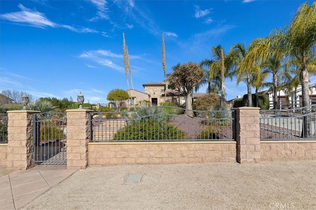 view of gate featuring a fenced front yard