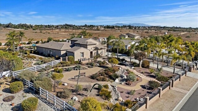 birds eye view of property featuring a mountain view