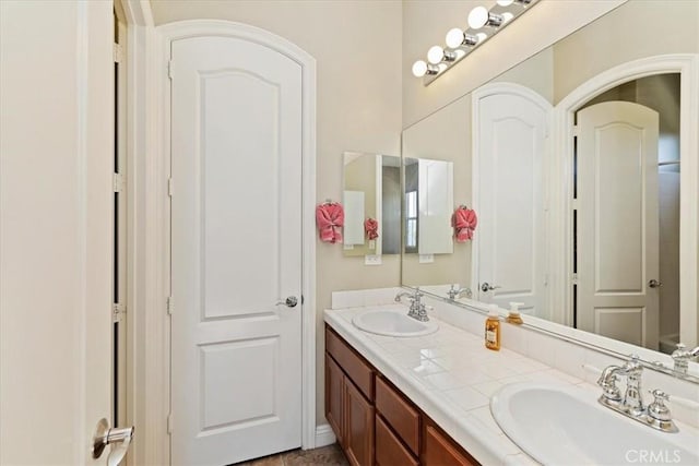 bathroom with double vanity and a sink