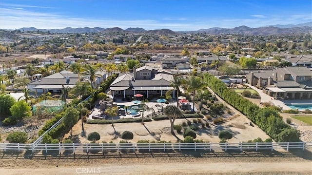 birds eye view of property with a residential view and a mountain view