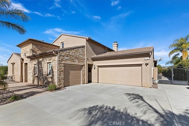 view of front facade featuring stucco siding, a garage, stone siding, driveway, and a gate