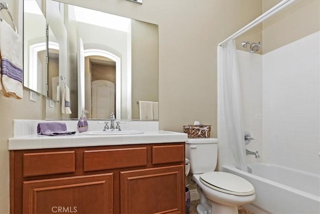 full bathroom with vanity, toilet, and shower / tub combo with curtain