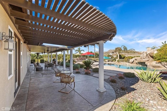 view of patio / terrace featuring an outdoor pool and a pergola