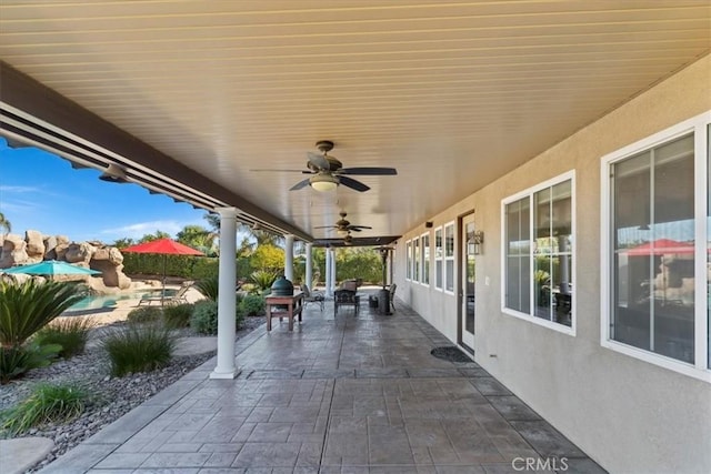 view of patio featuring ceiling fan