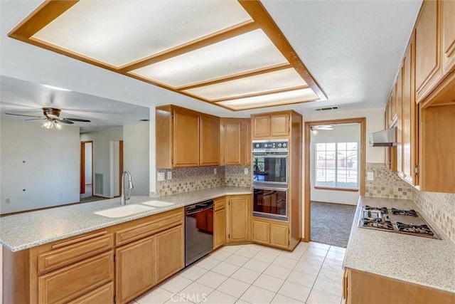 kitchen with black appliances, kitchen peninsula, sink, and tasteful backsplash