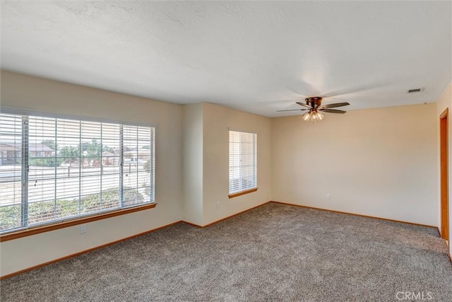 unfurnished room featuring carpet and ceiling fan