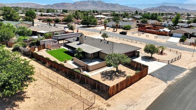 birds eye view of property with a mountain view