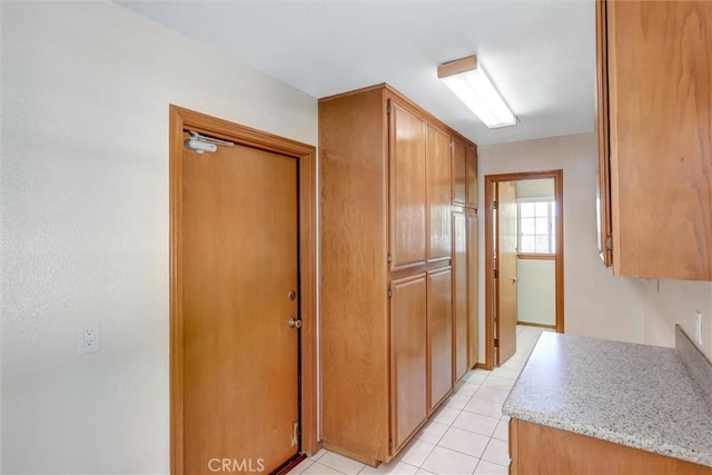 kitchen featuring light tile patterned flooring