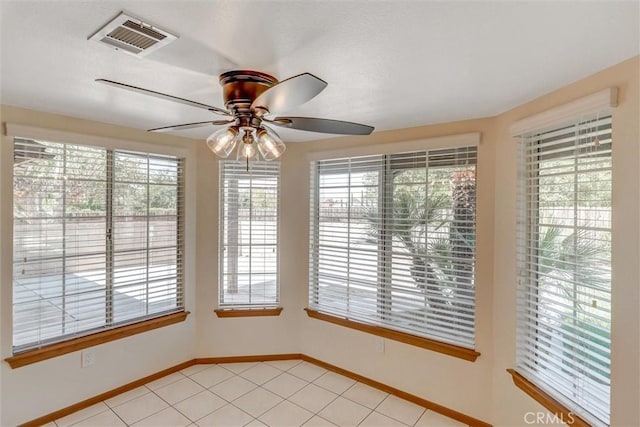 interior space with ceiling fan